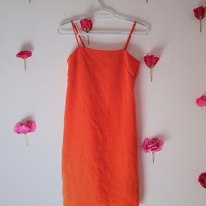 Orange sleek evening dress.